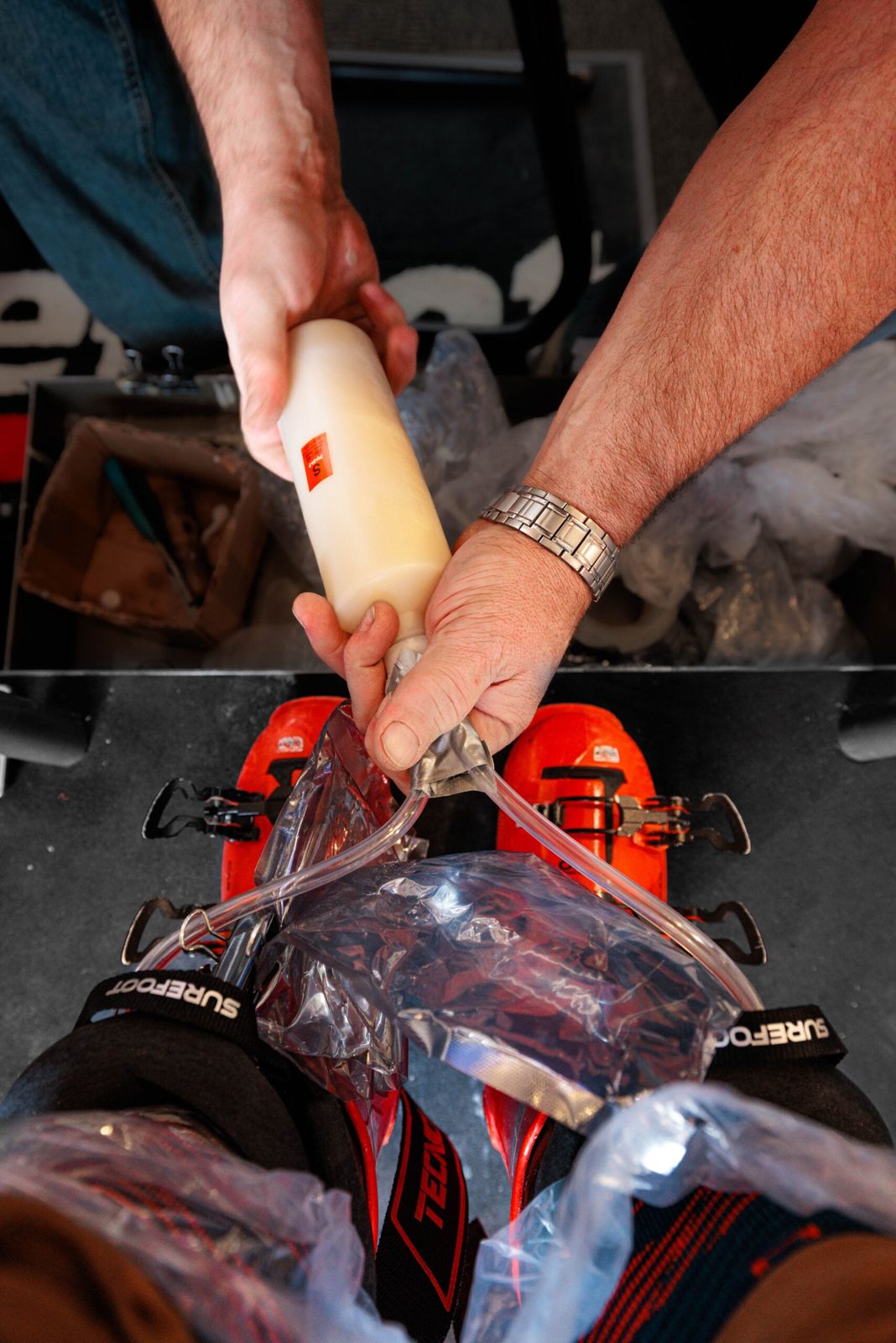 Foam being injected into a custom Surefoot liner in Park City, from SKI Magazine