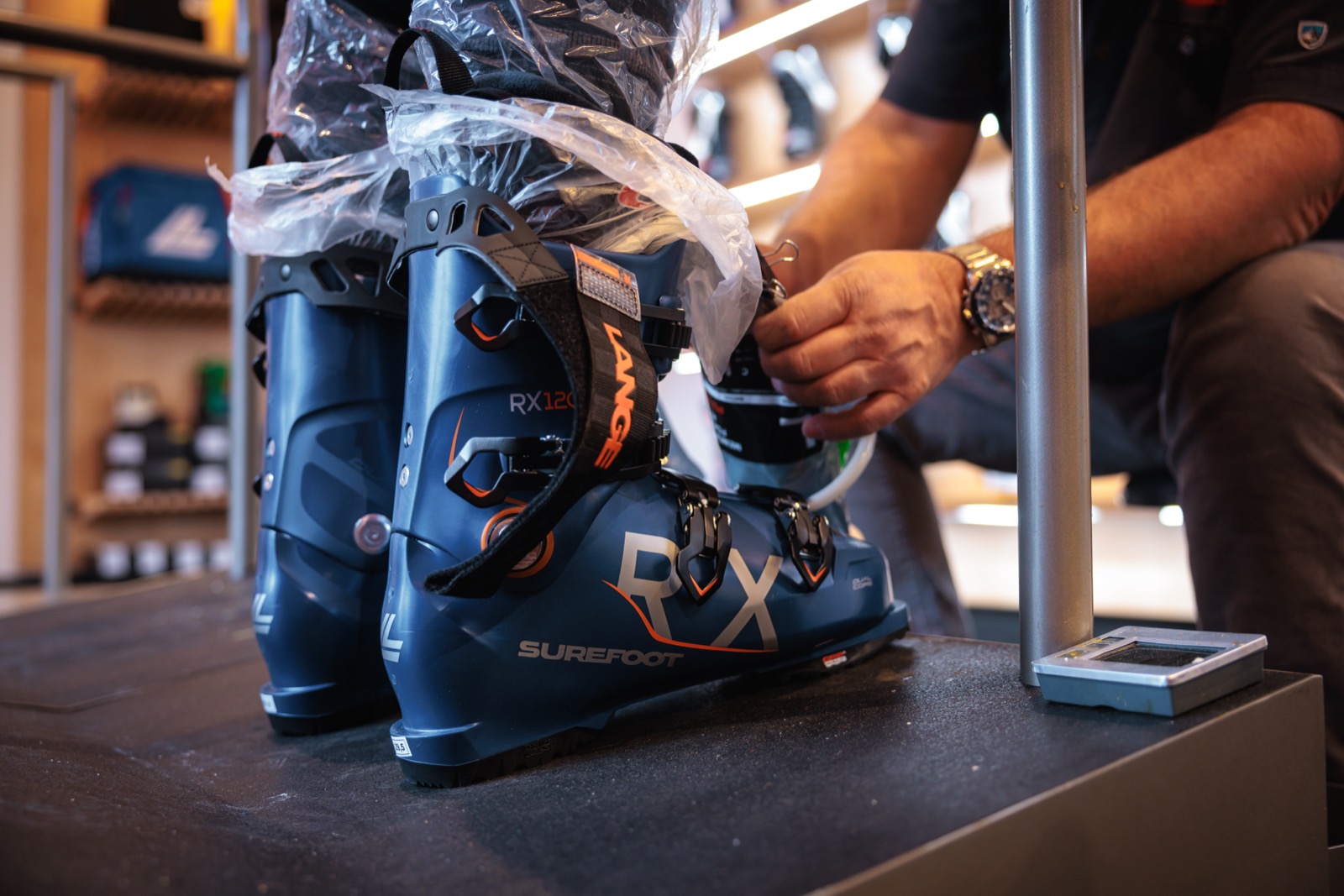 Memory-foam injection filling a custom liner inside a Surefoot ski boot